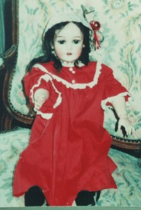 Doll with Long Hair in Red Cotton Dress image
