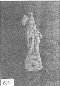 Figurine of Woman holding an Amphora beside figure of Eros image